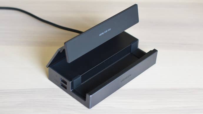 The Ugreen 9-in-1 Steam Deck dock on a table.