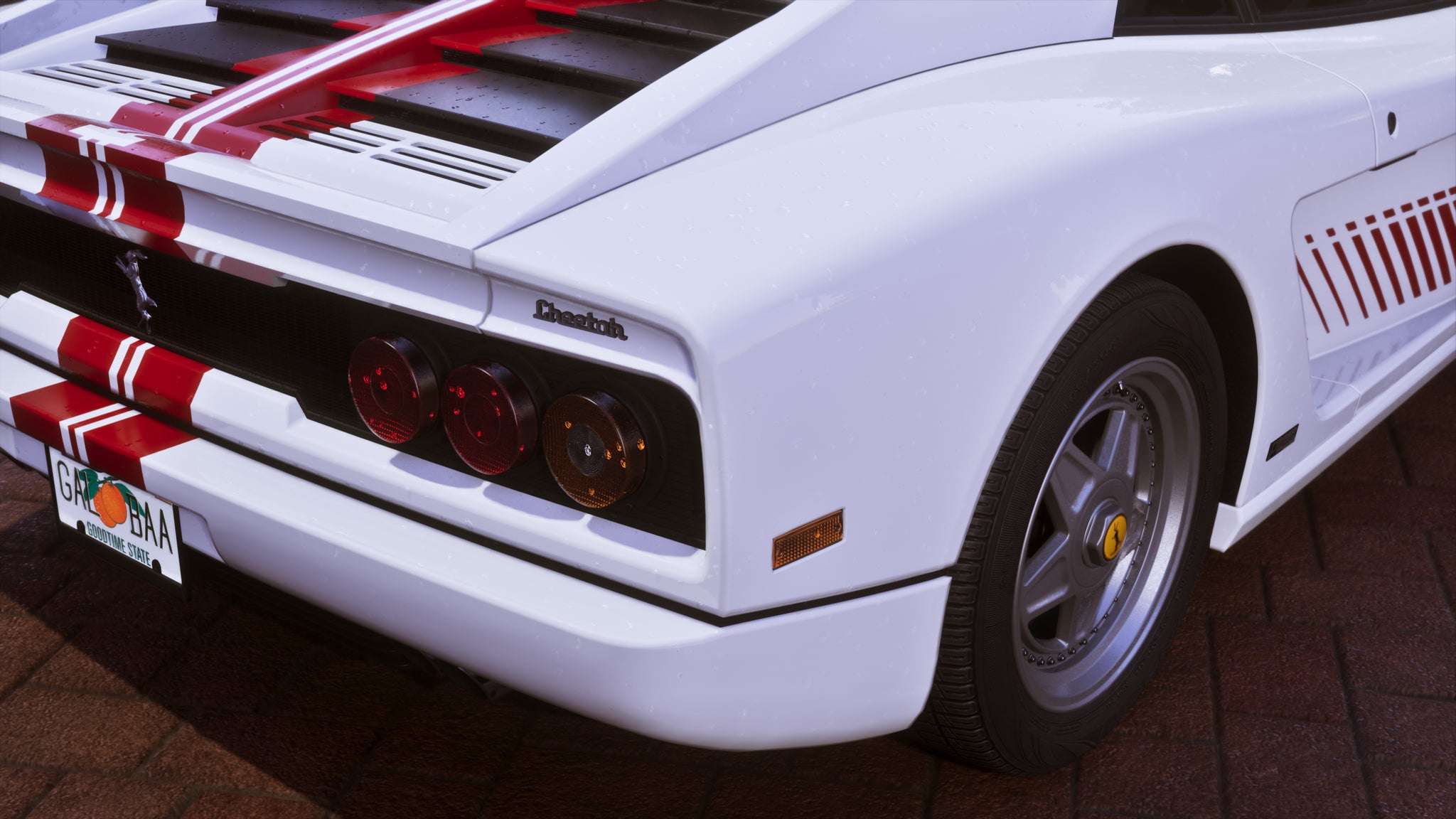 Official GTA 6 screenshot showing the rear corner of a white Grotti Cheetah with a red stripe down the middle. Tiny beads of water are visible on it up close.