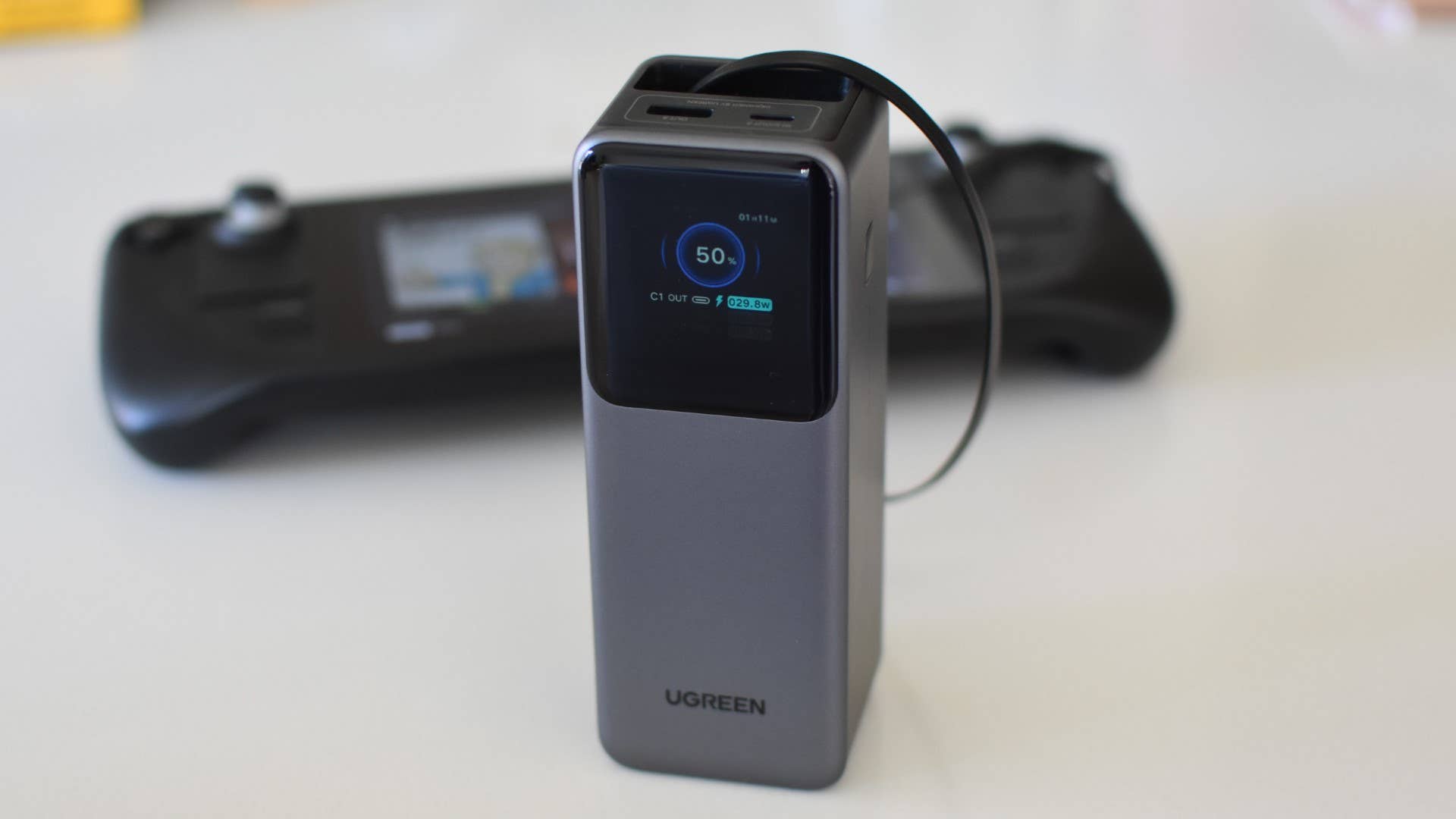 The Ugreen Nexode Retractable power bank charging a Steam Deck.