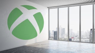 An empty office space with Xbox logo on the wall.