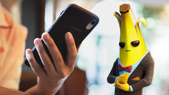 A suited Peely the banana stands next to a phone.