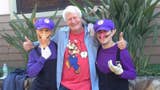 Charles Martinet with two cosplay Waluigis.