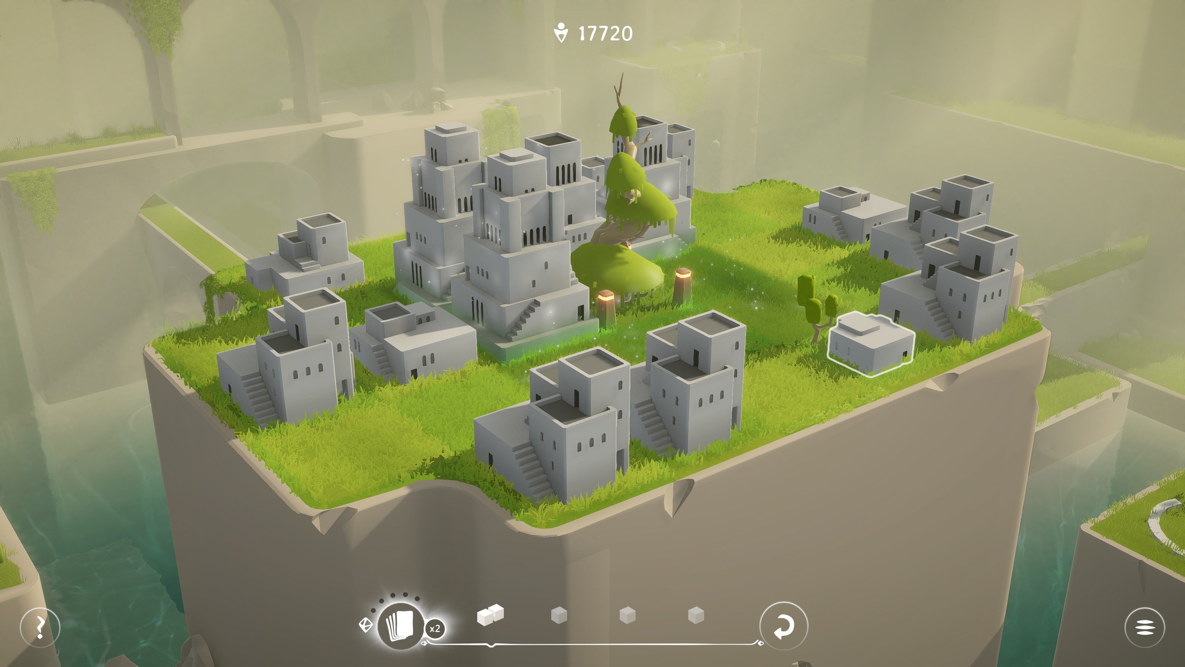 A grassy town is perched on a white cliff face in Urbo