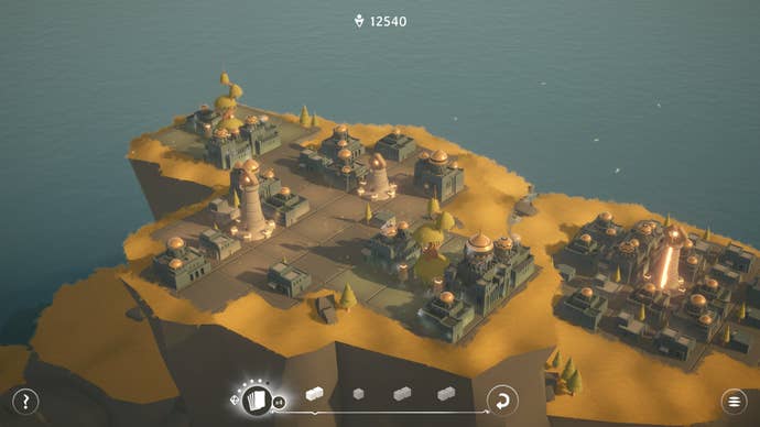 A mountainous coastal town spreads across yellow grasslands in Urbo