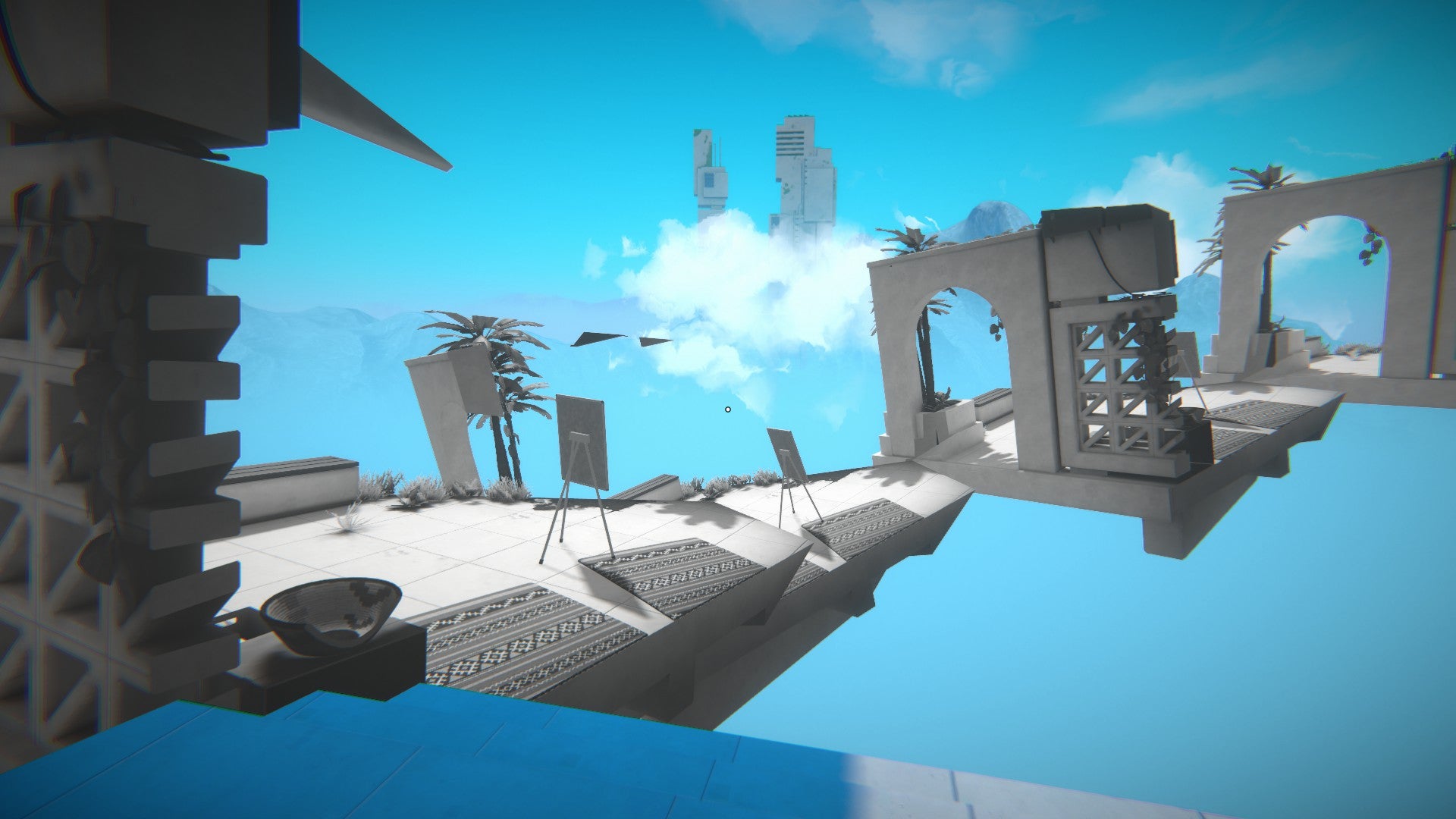 A bridge made from white and grey materials against a blue sky