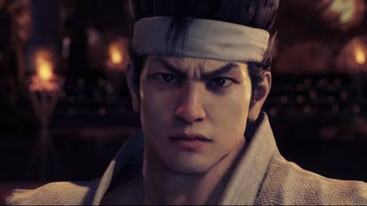 Virtua Fighter 5 REVO trailer screenshot showing Akira close up wearing white bandana