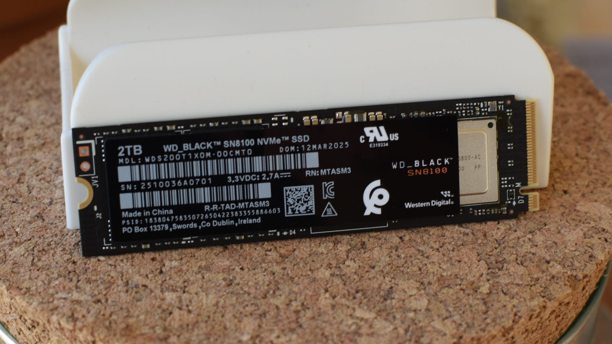 The WD Black SN8100 SSD, propped up connected its side.