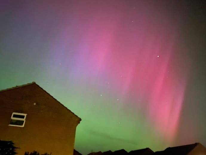A photograph of the aurora borealis as seen from Christian Donlan's garden. What a show off!