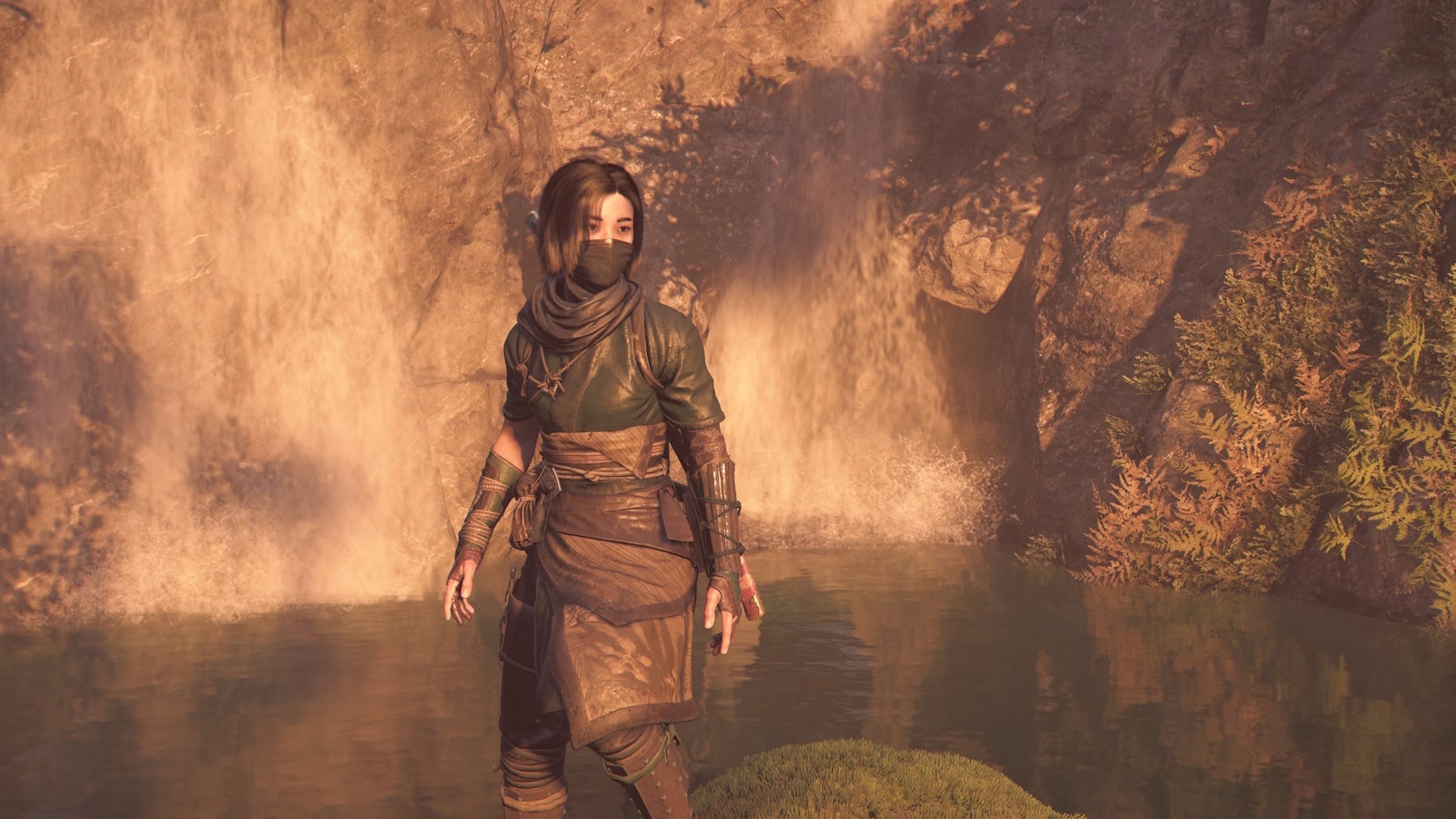 Naoe standing in front of a waterfall in Assassin&rsquo;s Creed Shadows.