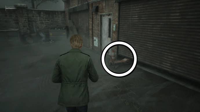 A white circle showing where to use the Garage Jack Lever in Silent Hill 2.