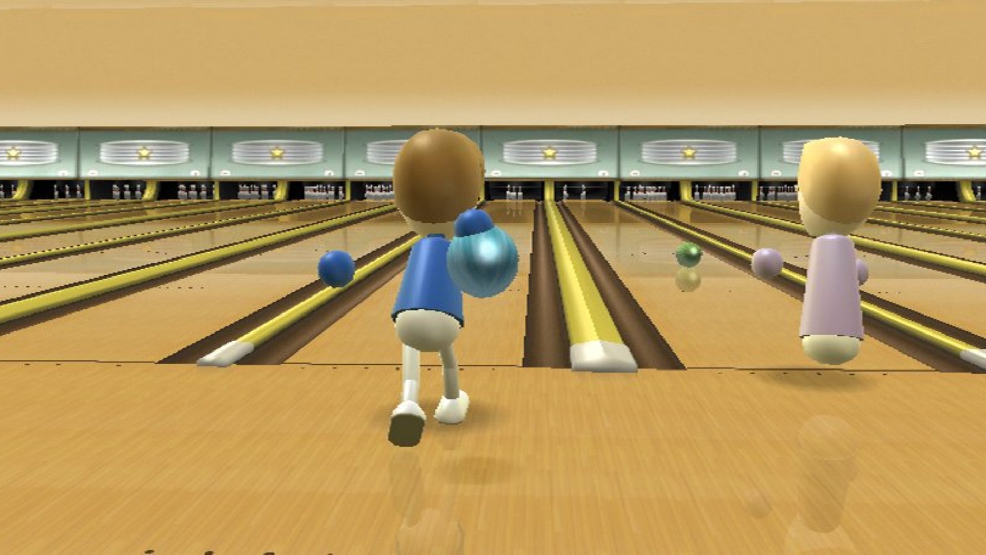 Two characters bowl beside each other in Wii Sports bowling