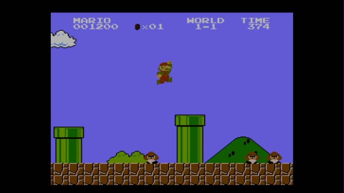 Best Mario Games - Super Mario Bros. screenshot showing Mario jumping over a pipe in the classic 1-1 level.