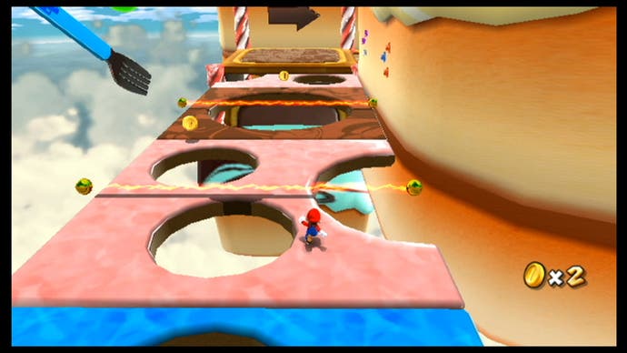 Best Mario Games - Super Mario Galaxy screenshot showing a tiny Mario running away from the camera through obstacles in the sky.