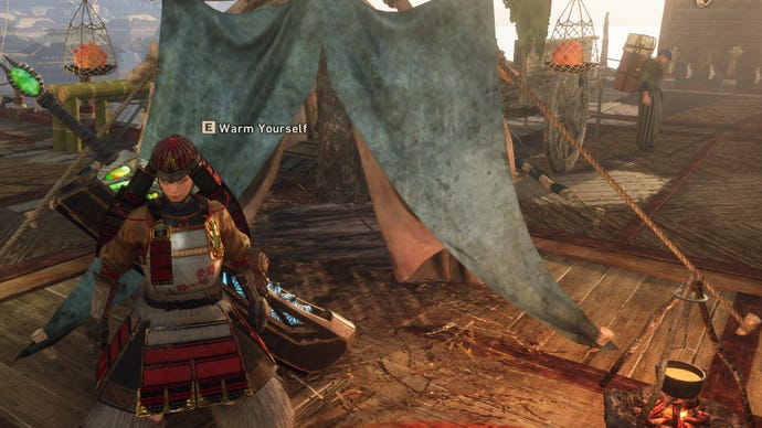 Wild Hearts image showing a player next to the tent and campfire Dragon Karakuri.