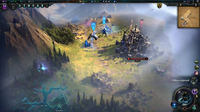 A city sits in a misty forest and mountains in Age Of Wonders 4