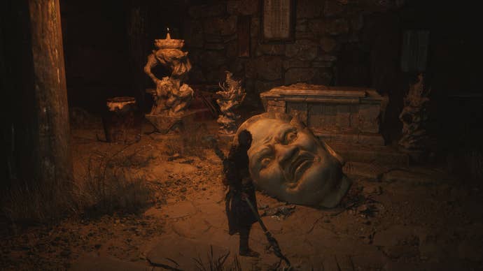 The player approaches a Buddha Head, where they can retrieve the Buddha’s Eyeballs, in Black Myth Wukong