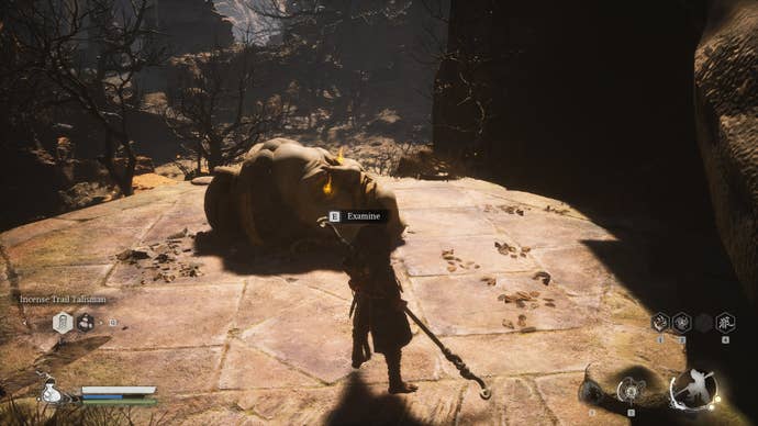 The player approaches a Buddha Head, where they can retrieve the Buddha’s Eyeballs, in Black Myth Wukong