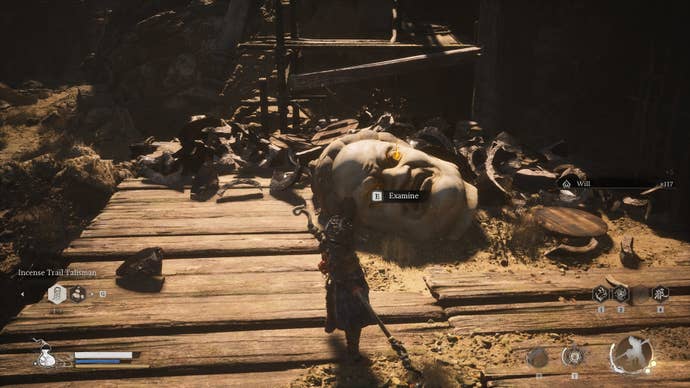 The player approaches a Buddha Head, where they can retrieve the Buddha’s Eyeballs, in Black Myth Wukong