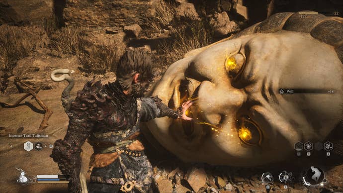 The player approaches a Buddha Head, where they can retrieve the Buddha's Eyeballs, in Black Myth Wukong