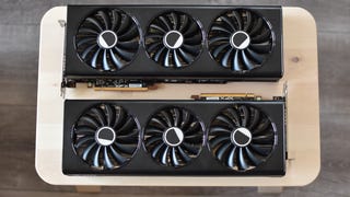 The XFX Speedster QICK 319 Radeon RX 7700 XT Black Edition and XFX Speedster QICK 319 Radeon RX 7800 XT Core Edition graphics cards on a small table.