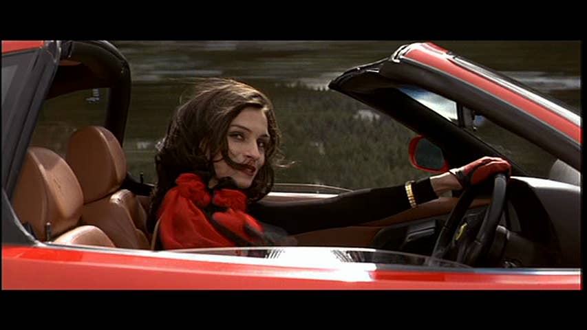 Xenia Onatopp in a red car in GoldenEye