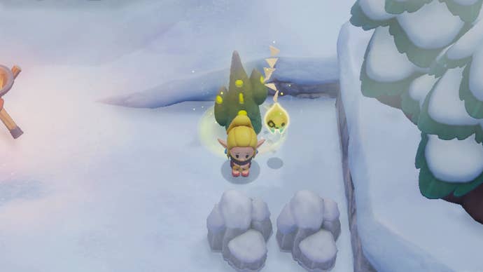 Princess Zelda shivering from the cold on top of Hebra Mountain in Zelda: Echoes of Wisdom.