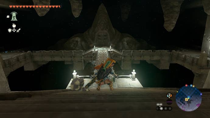 Link looks at the Great Abandoned Central Mine Bargainer Statue in The Legend of Zelda: Tears of the Kingdom