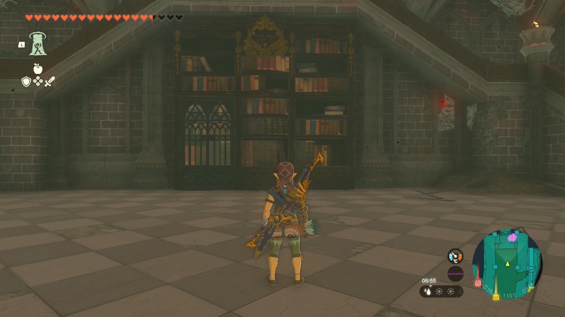 Link faces a bookcase in the Hyrule Castle Library in The Legend of Zelda: Tears of the Kingdom - 13