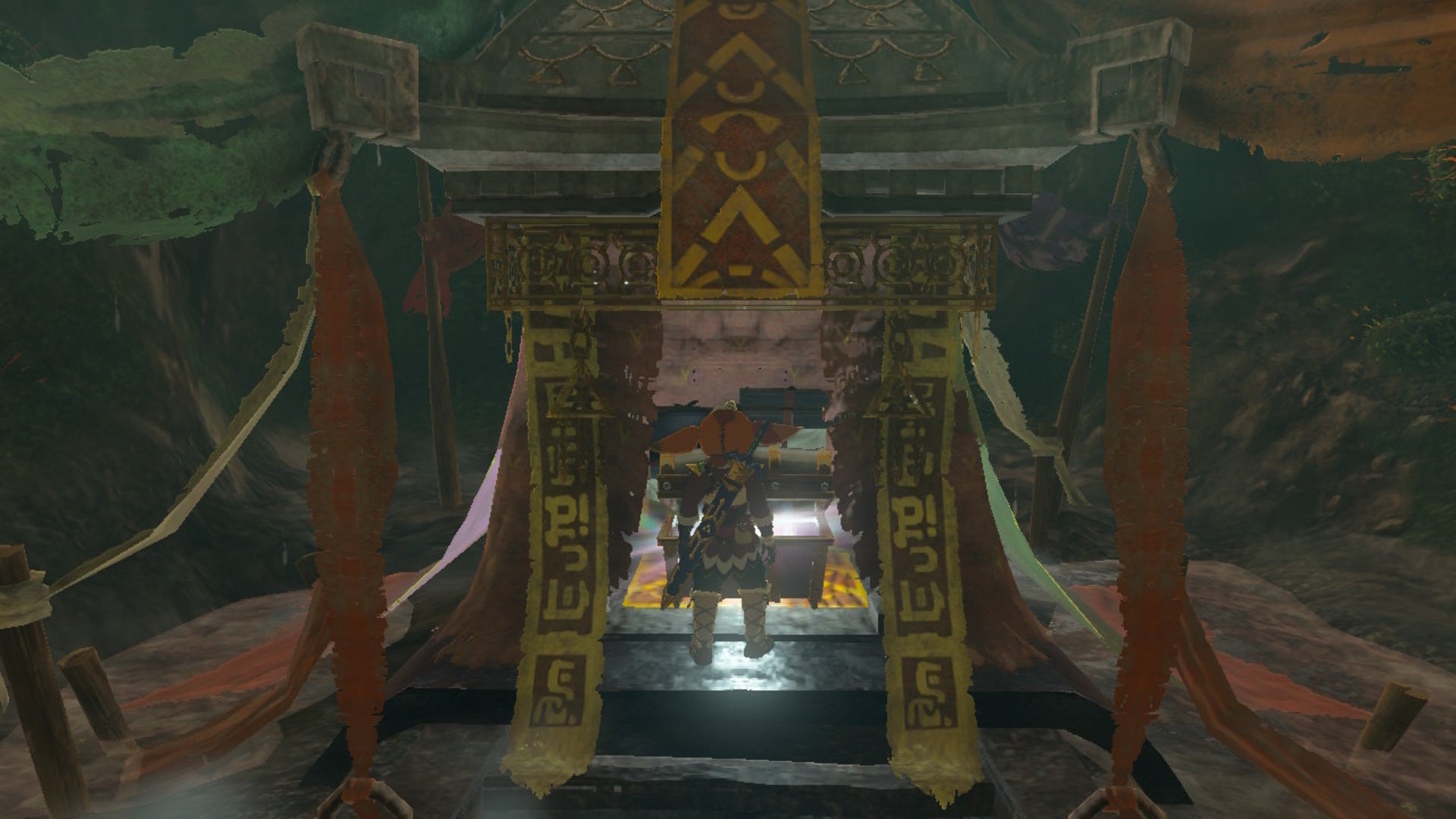 Link opens a chest in a cave in The Legend of Zelda: Tears of the Kingdom