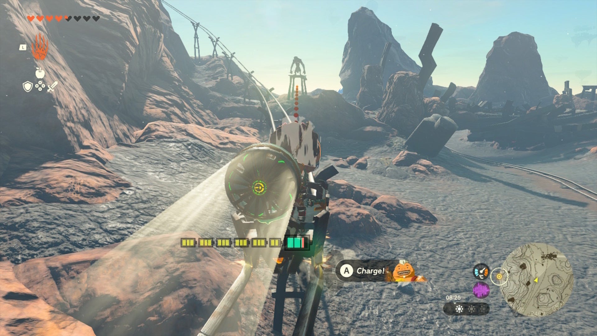 Link aims Yunobo at an enemy while riding a cart up Death Mountain in The Legend of Zelda: Tears of the Kingdom