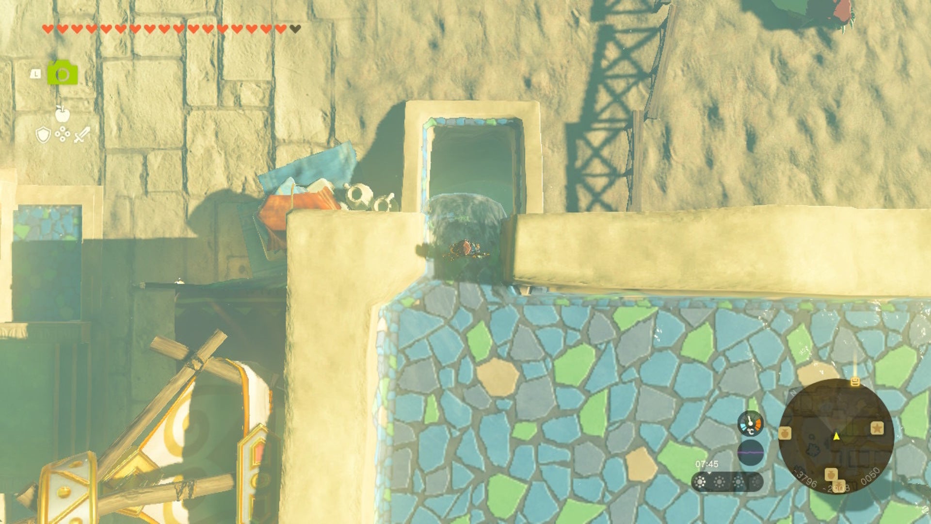 Link looks down at a waterfall in Gerudo Town in The Legend of Zelda: Tears of the Kingdom - 6