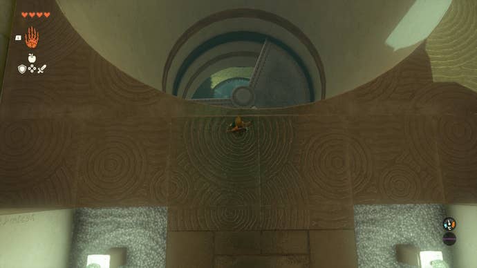 Link looks down at a moving wind turbine in the Gatakis Shrine in Zelda: Tears of the Kingdom