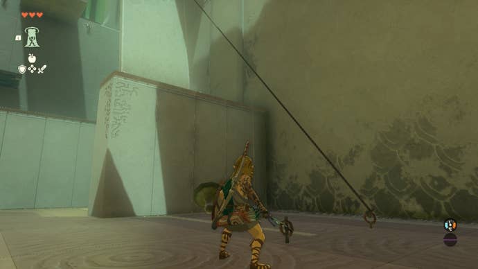 Link stands by a rope bridge having cut one of the ropes suspending it in the Gutanbac Shrine in The Legend of Zelda: Tears of the Kingdom