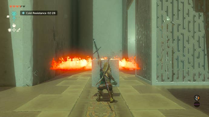 Link uses a stone slab shield to get past some fire in the Ijo-o Shrine in The Legend of Zelda: Tears of the Kingdom