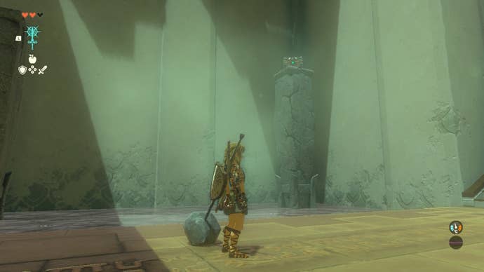 Link looks at a chest on top of a stone pillar in the In-Isa Shrine in The Legend of Zelda: Tears of the Kingdom