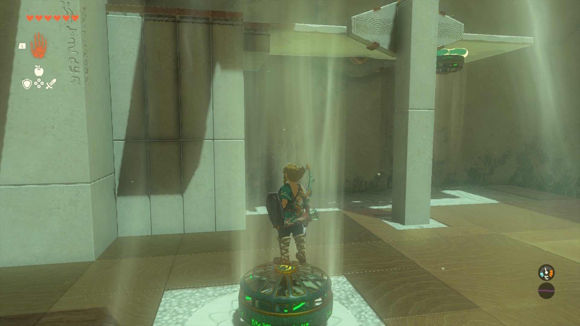 Link stands on top of a fan while looking over at a seesaw in the Ishodag Shrine in The Legend of Zelda: Tears of the Kingdom