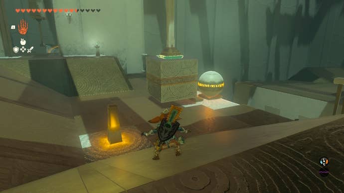 Link attaches a metal block in a pillar in The Legend of Zelda: Tears of the Kingdom