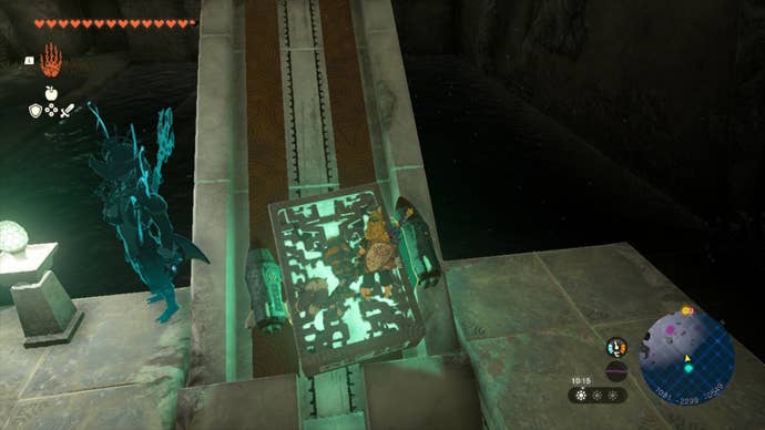 Link places a Zonai Relic on a bridge with some missiles attached to it in The Legend of Zelda: Tears of the Kingdom