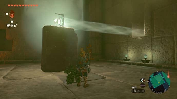 Link stands beside a rock and mirror that is reflecting light in The Legend of Zelda: Tears of the Kingdom
