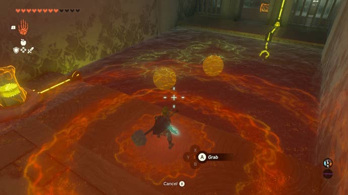Link moves some balls underwater using Ultrahand in The Legend of Zelda: Tears of the Kingdom
