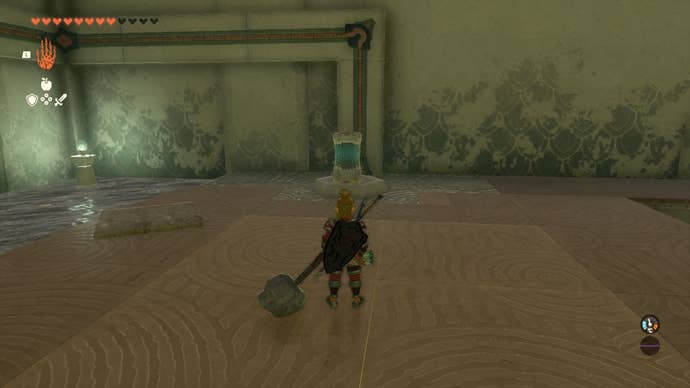 Link places a dead battery on a pedestal in The Legend of Zelda: Tears of the Kingdom