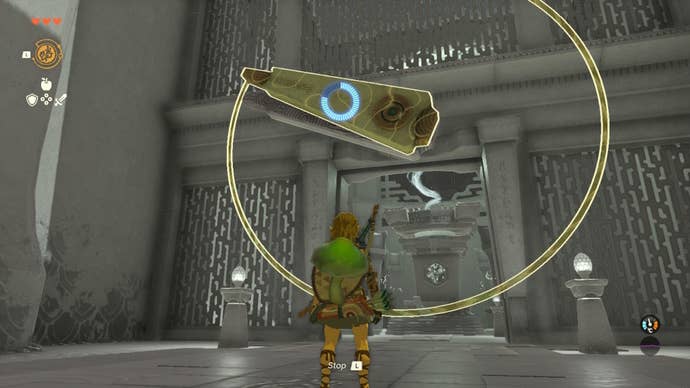 Link uses Recall on some clock hands that are locking a gate in the Nachoyah Shrine of The Legend of Zelda: Tears of the Kingdom