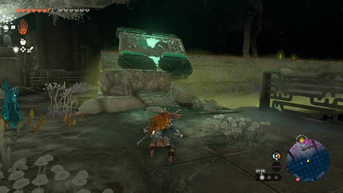 Link looks up at a car made of wheels and a relic in The Legend of Zelda: Tears of the Kingdom