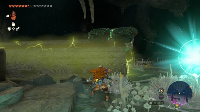 Link looks up at a car placed on a bridge in The Legend of Zelda: Tears of the Kingdom