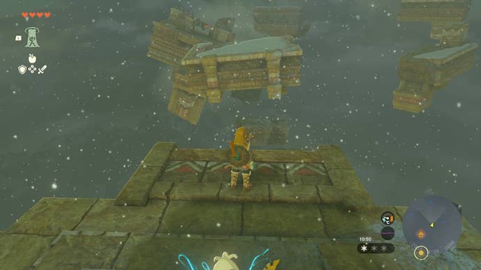 Link stands on a ledge with a trampoline beneath it in The Legend of Zelda: Tears of the Kingdom