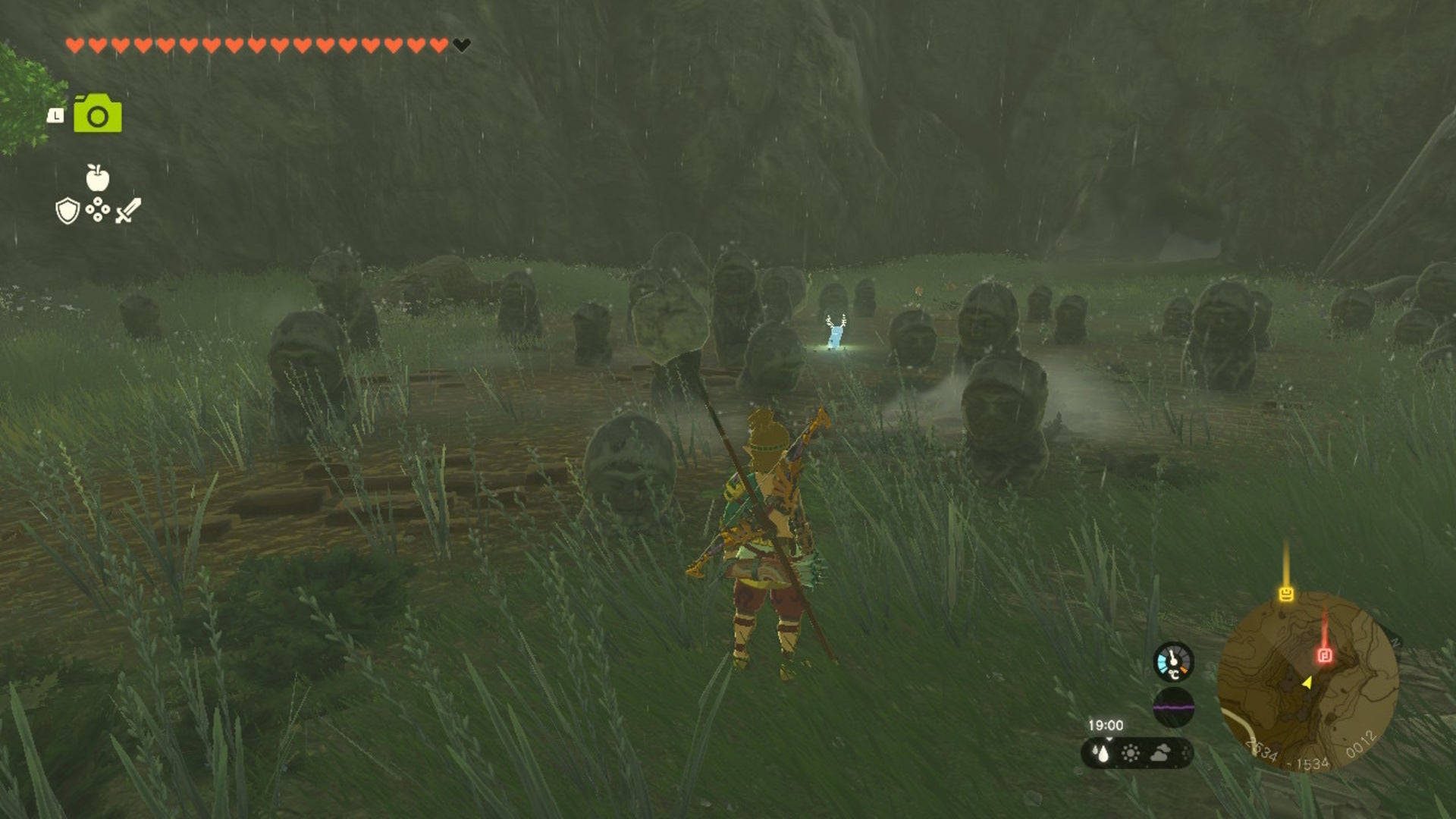 Link stands by some statues outside Robred Dropoff Cave  in The Legend of Zelda: Tears of the Kingdom