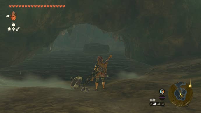 Link looks toward a stone platform in the water in a cave in The Legend of Zelda: Tears of the Kingdom