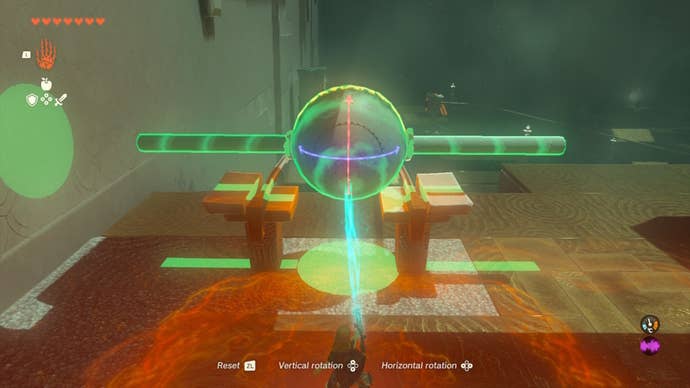 Link places a ball with two poles attached to either side on a track in the Runakit Shrine in The Legend of Zelda: Tears of the Kingdom