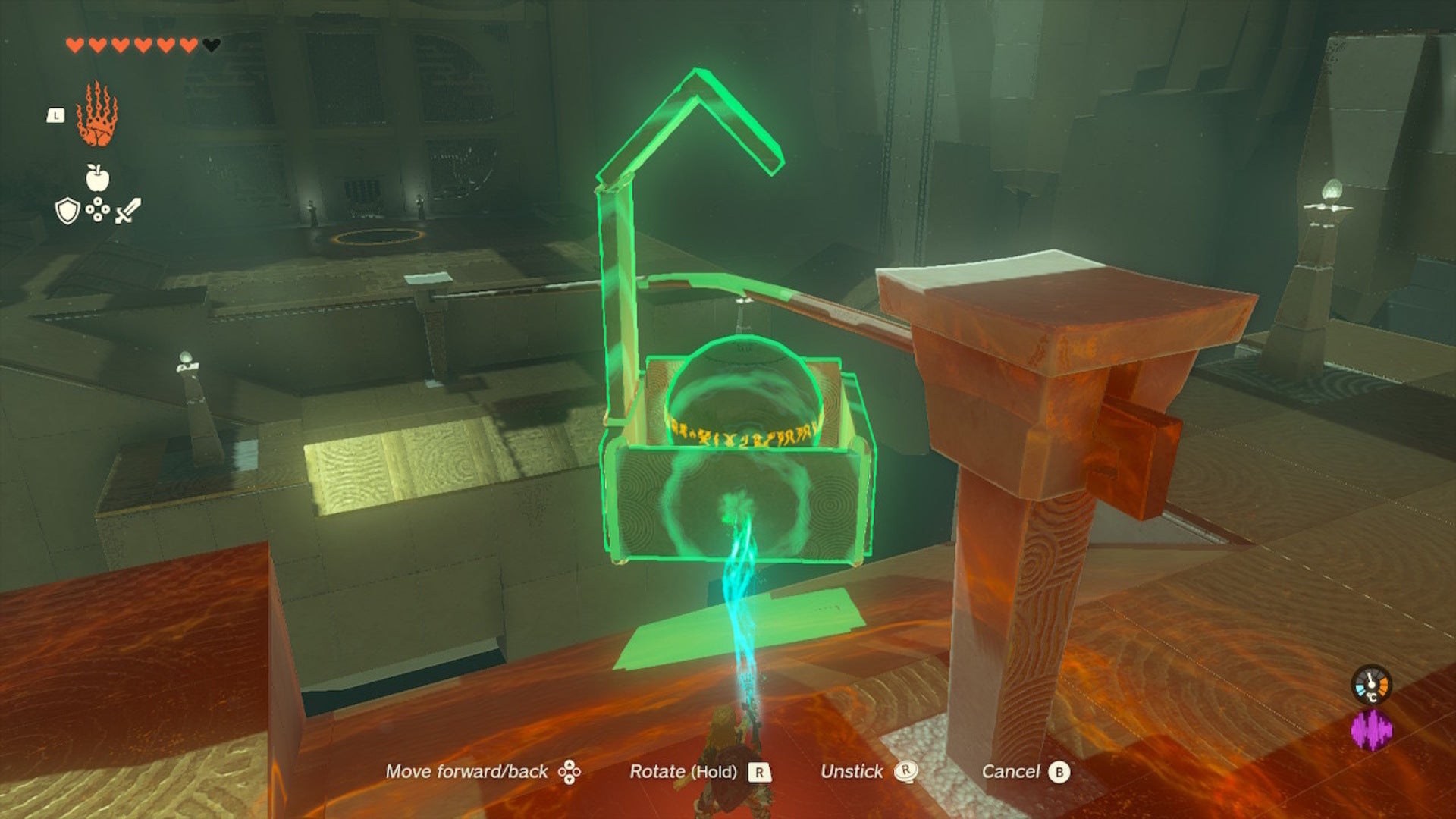 Link places a contraption, a box with a ball in it, on a railing in the Runakit Shrine in The Legend of Zelda: Tears of the Kingdom - 9