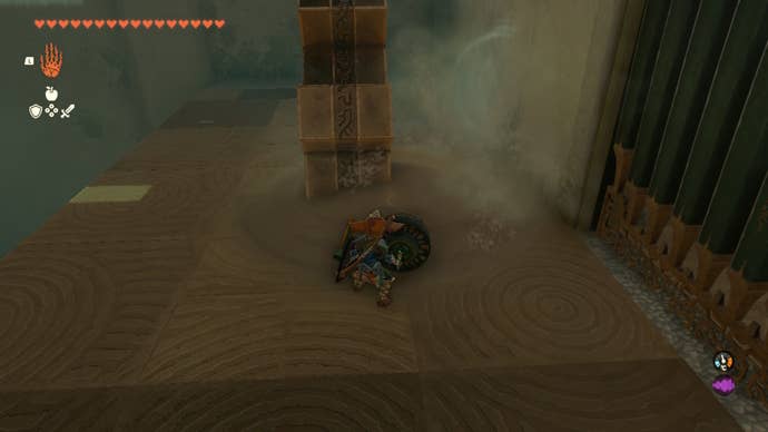 Link uses a Fan Guster on a pile of sand in The Legend of Zelda: Tears of the Kingdom
